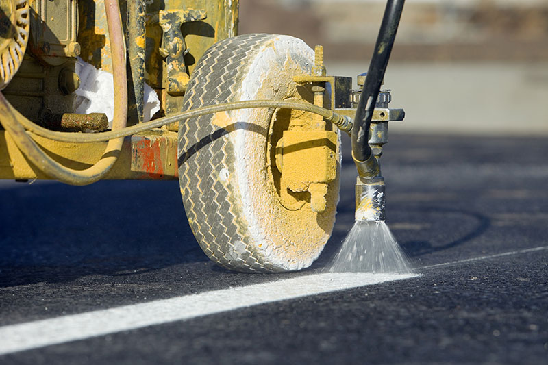 closeup of line marking machinery in action